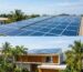 Modern rooftop monocrystalline solar photovoltaic panel installation on a Nigerian home under bright sunlight.